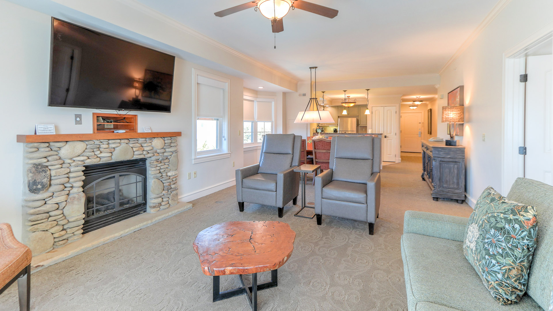 a living room with a fireplace and a television