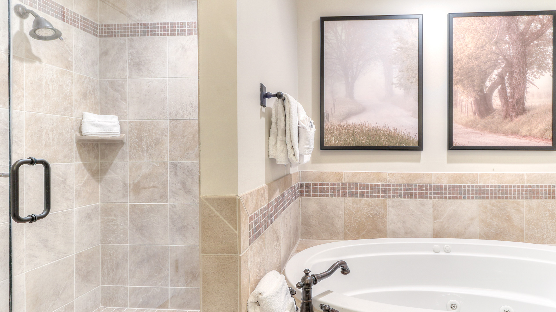 a bathroom with a tub and shower