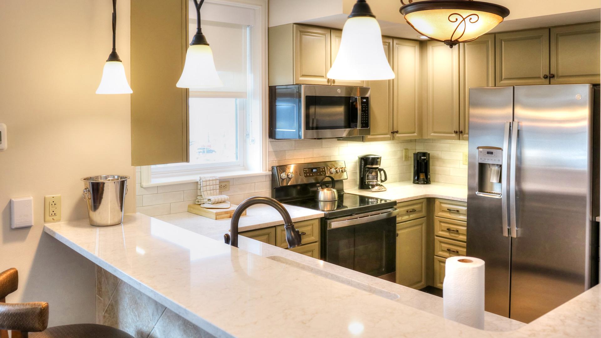 a kitchen with a white counter top