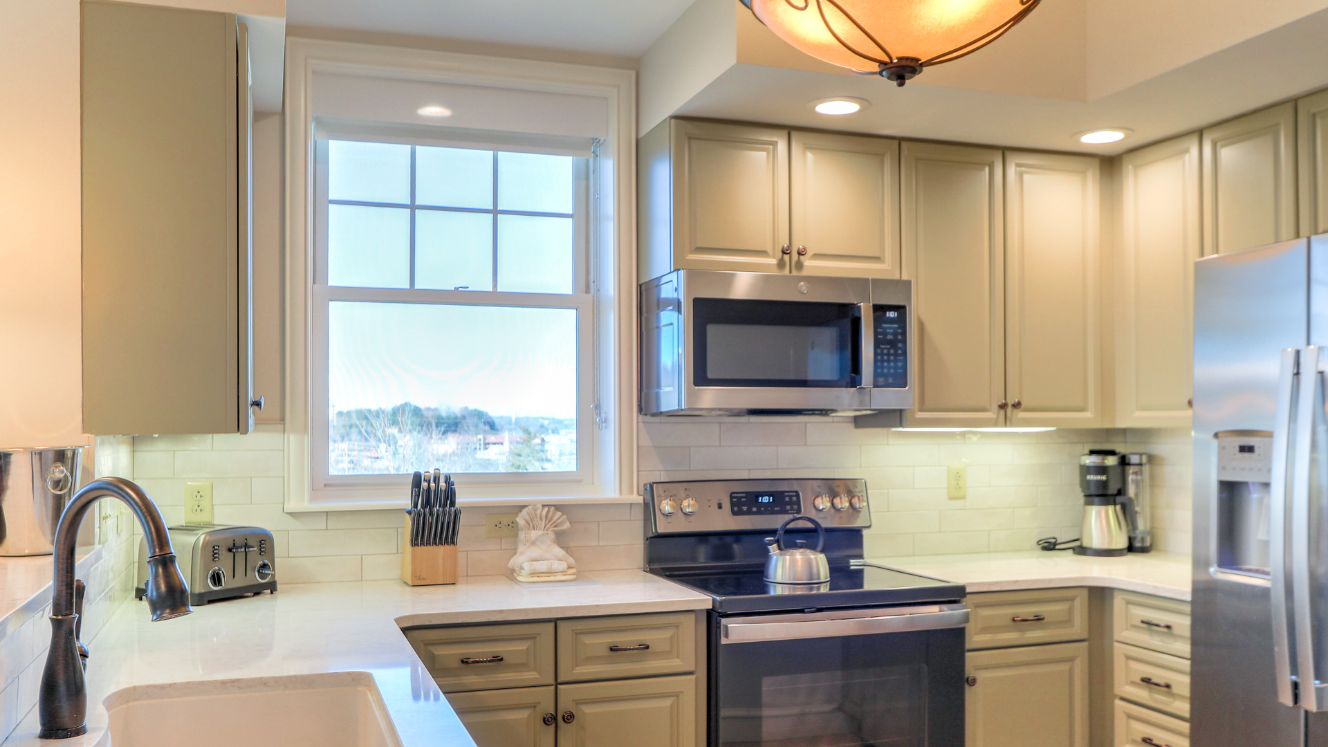 a kitchen with a light fixture