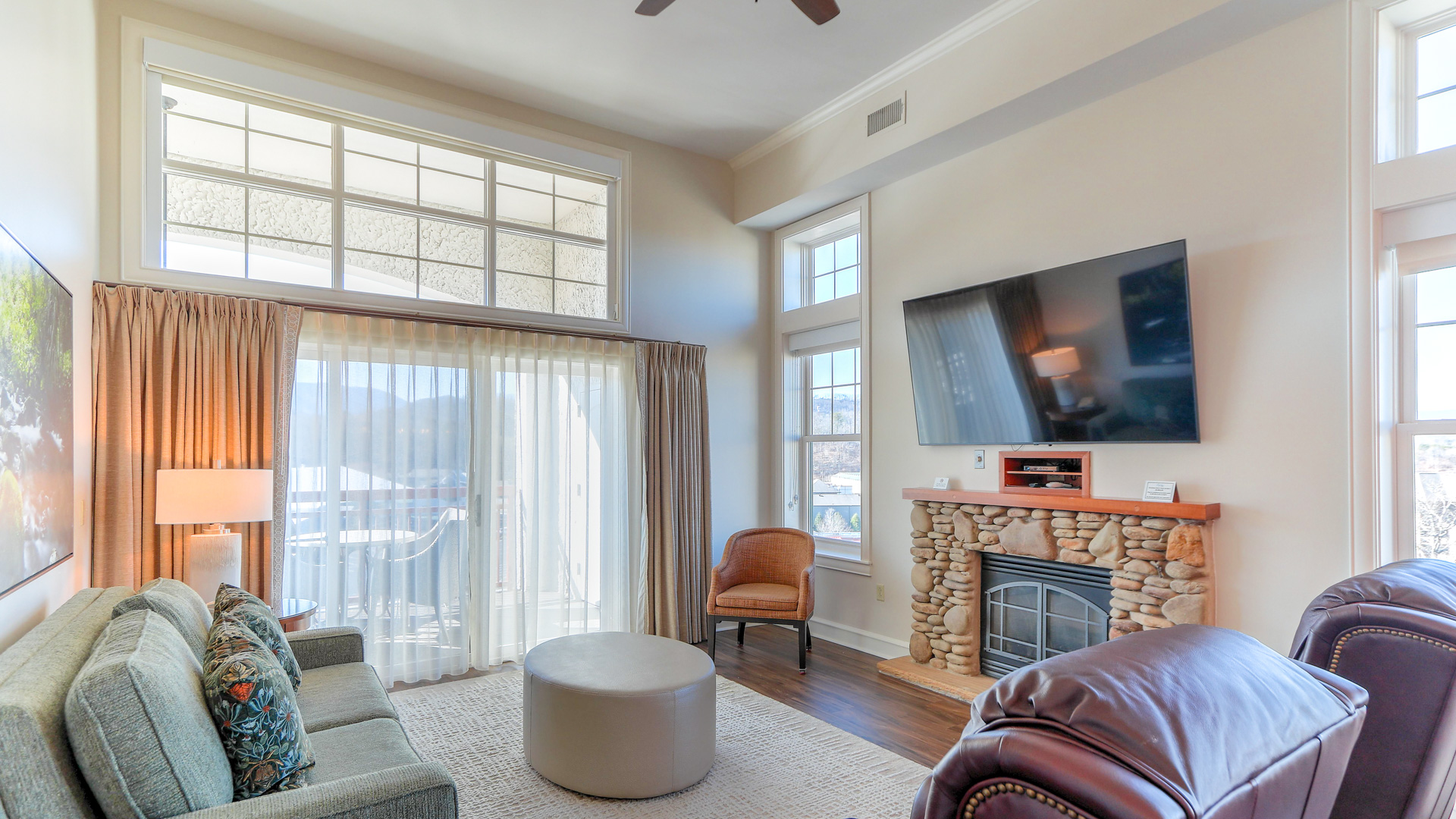 a living room with a fireplace and a television