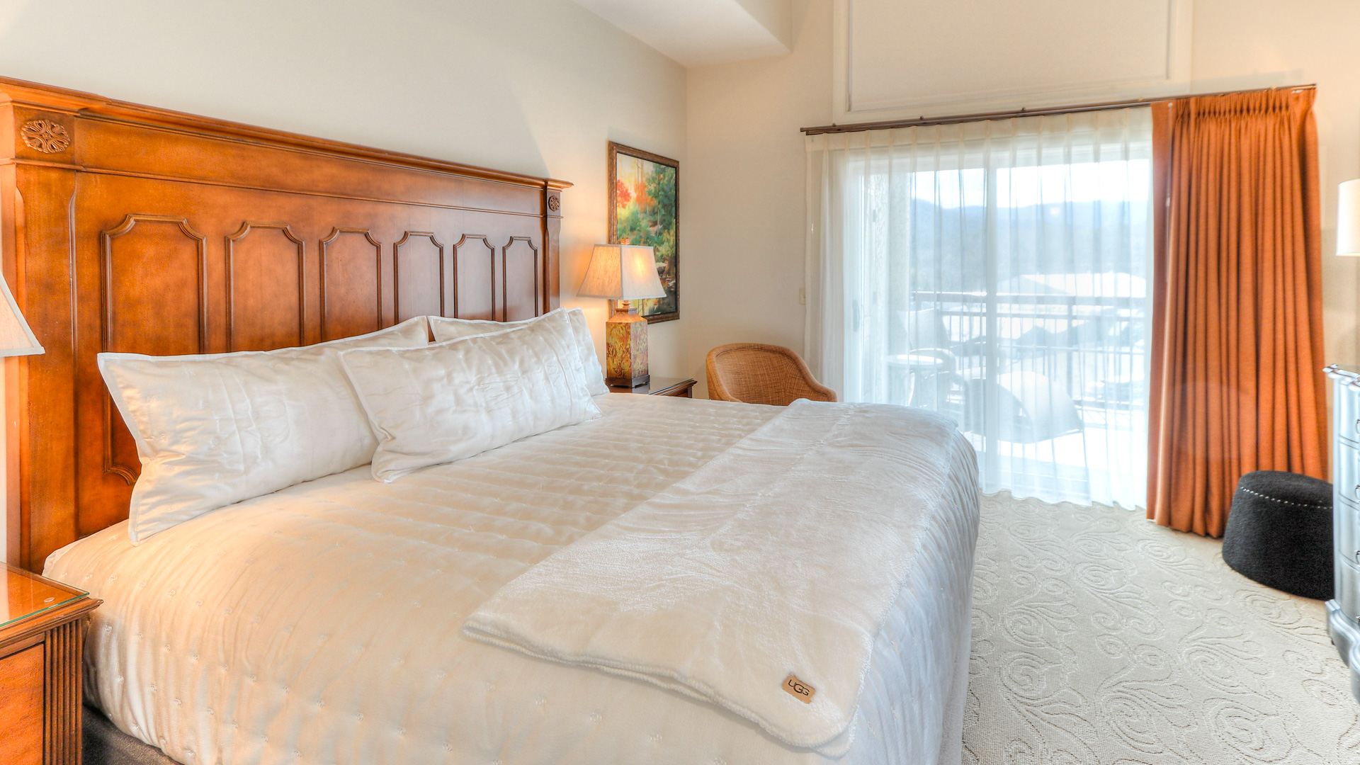 a bed with a lamp and a table
