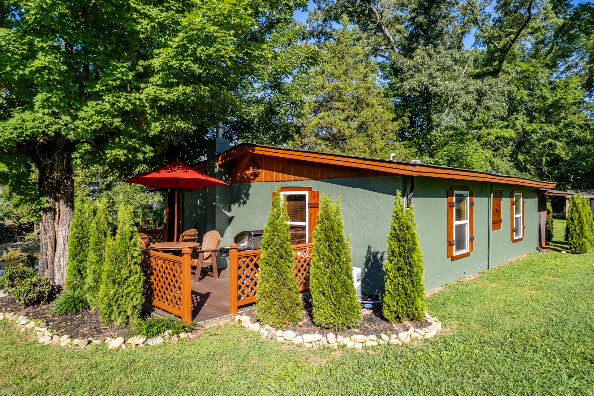 a house with a deck and trees