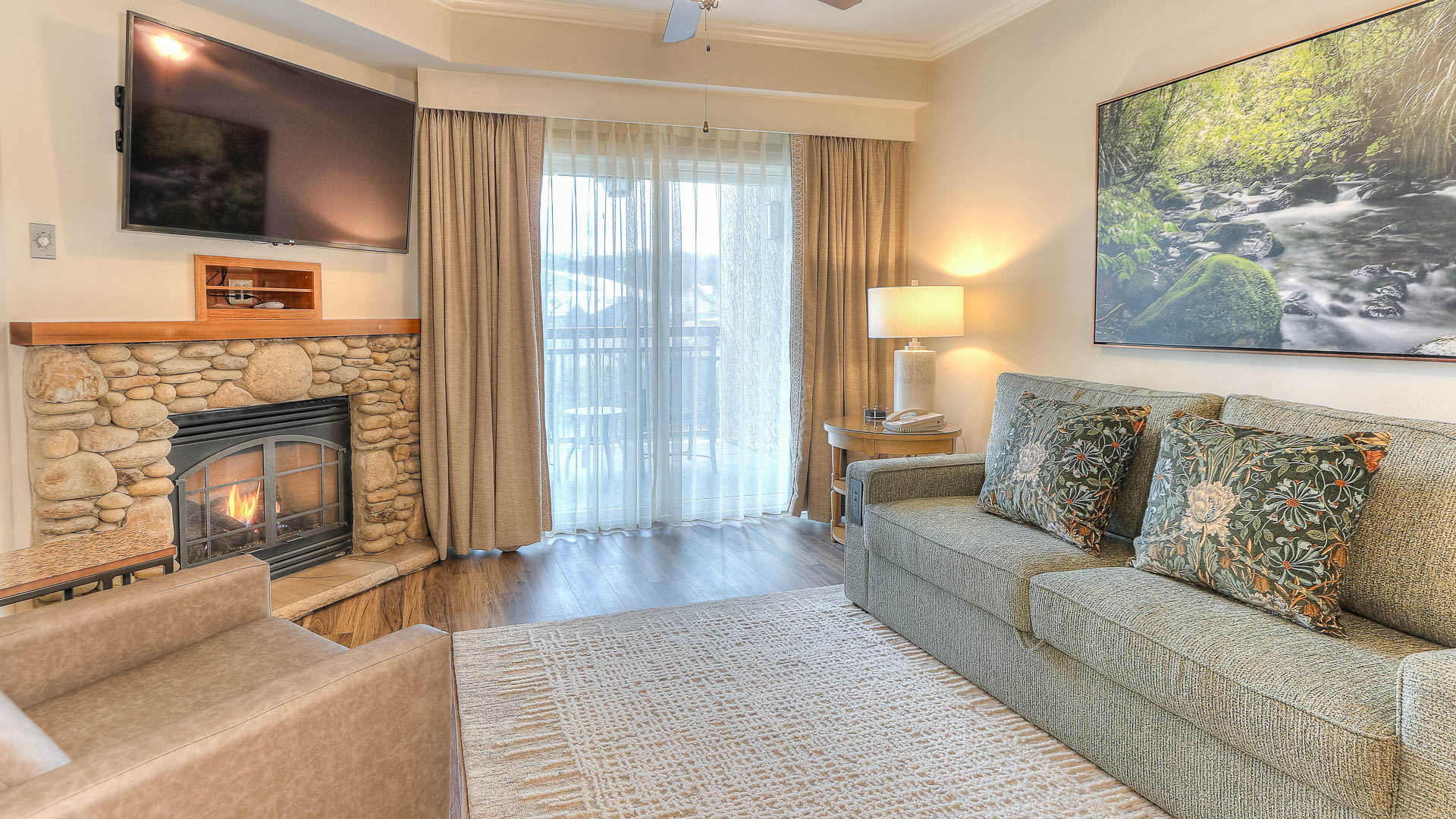 a living room with a fireplace and couch