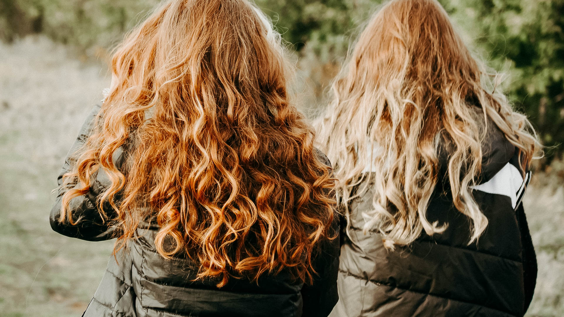 a group of women with long hair