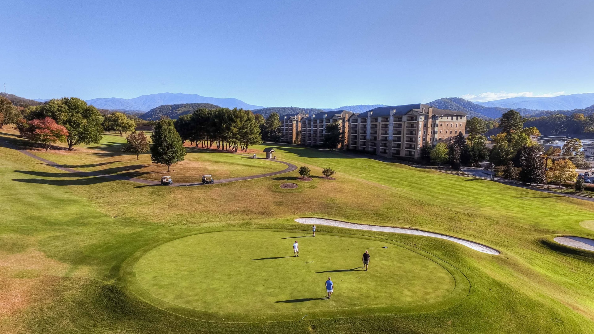 a group of people on a golf course