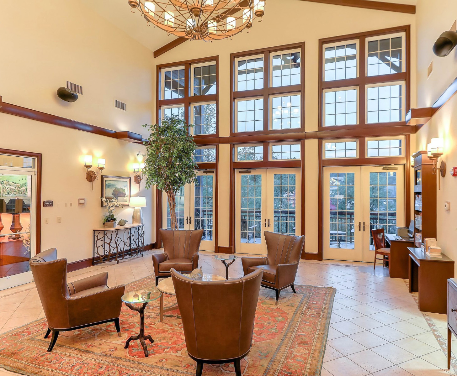a room with chairs and a chandelier