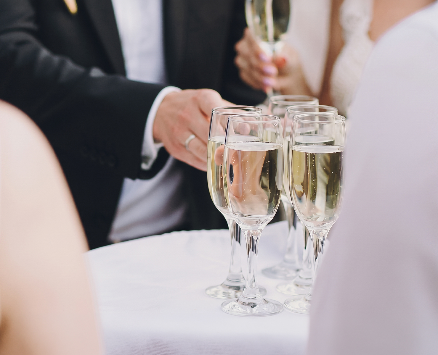 a group of people holding champagne glasses