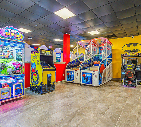 a room with arcade games and toys