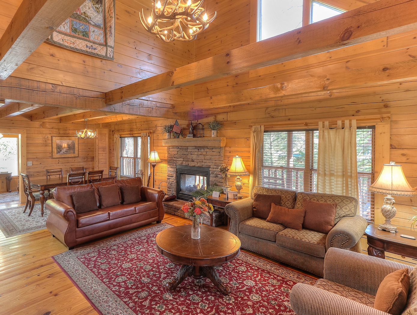 a living room with a fireplace and couches