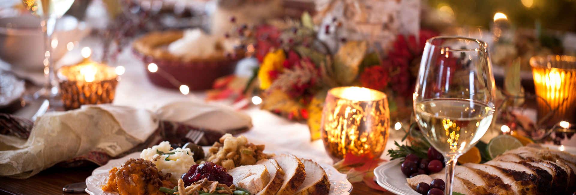 a plate of turkey and a candle