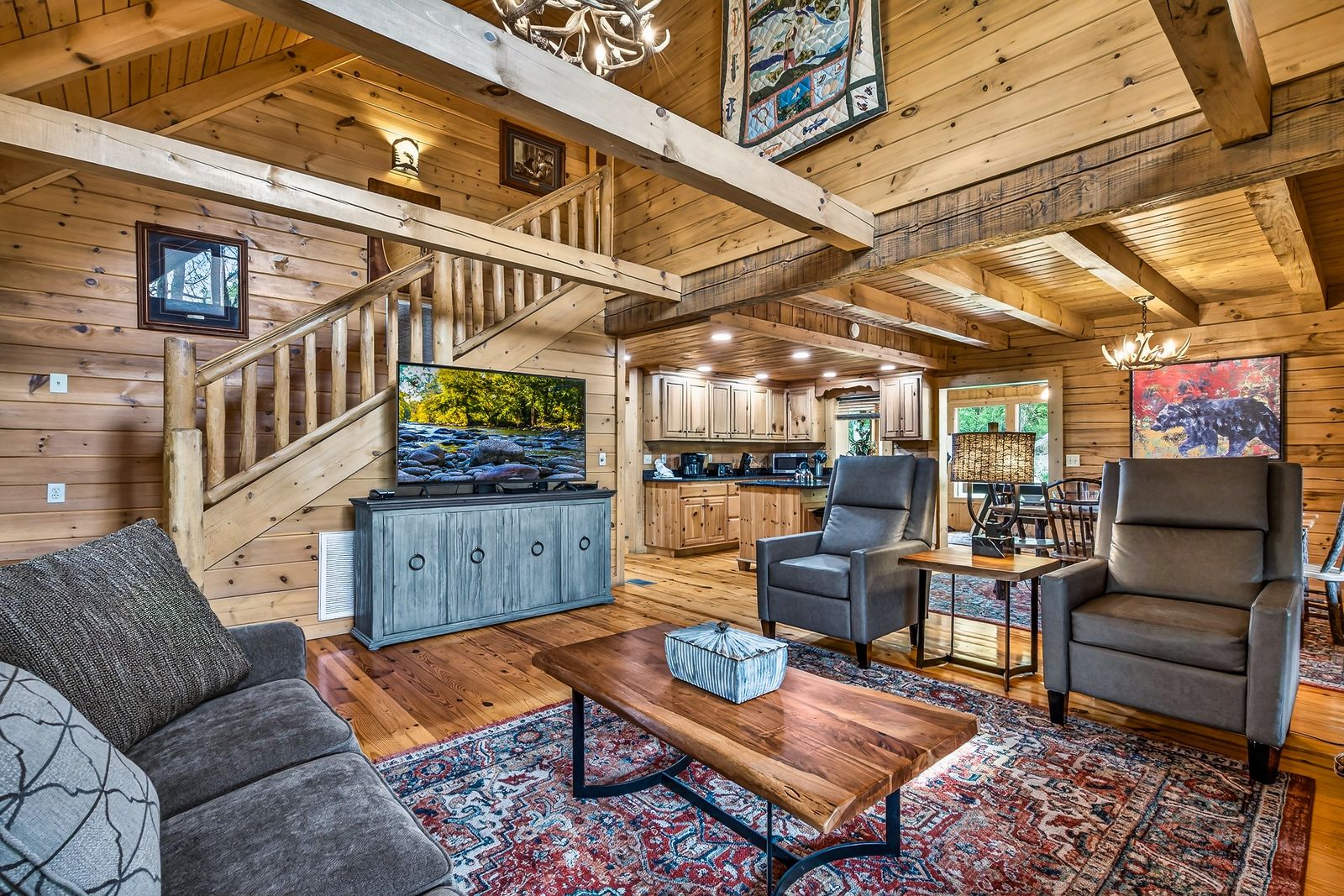 a living room with a television and a wood floor