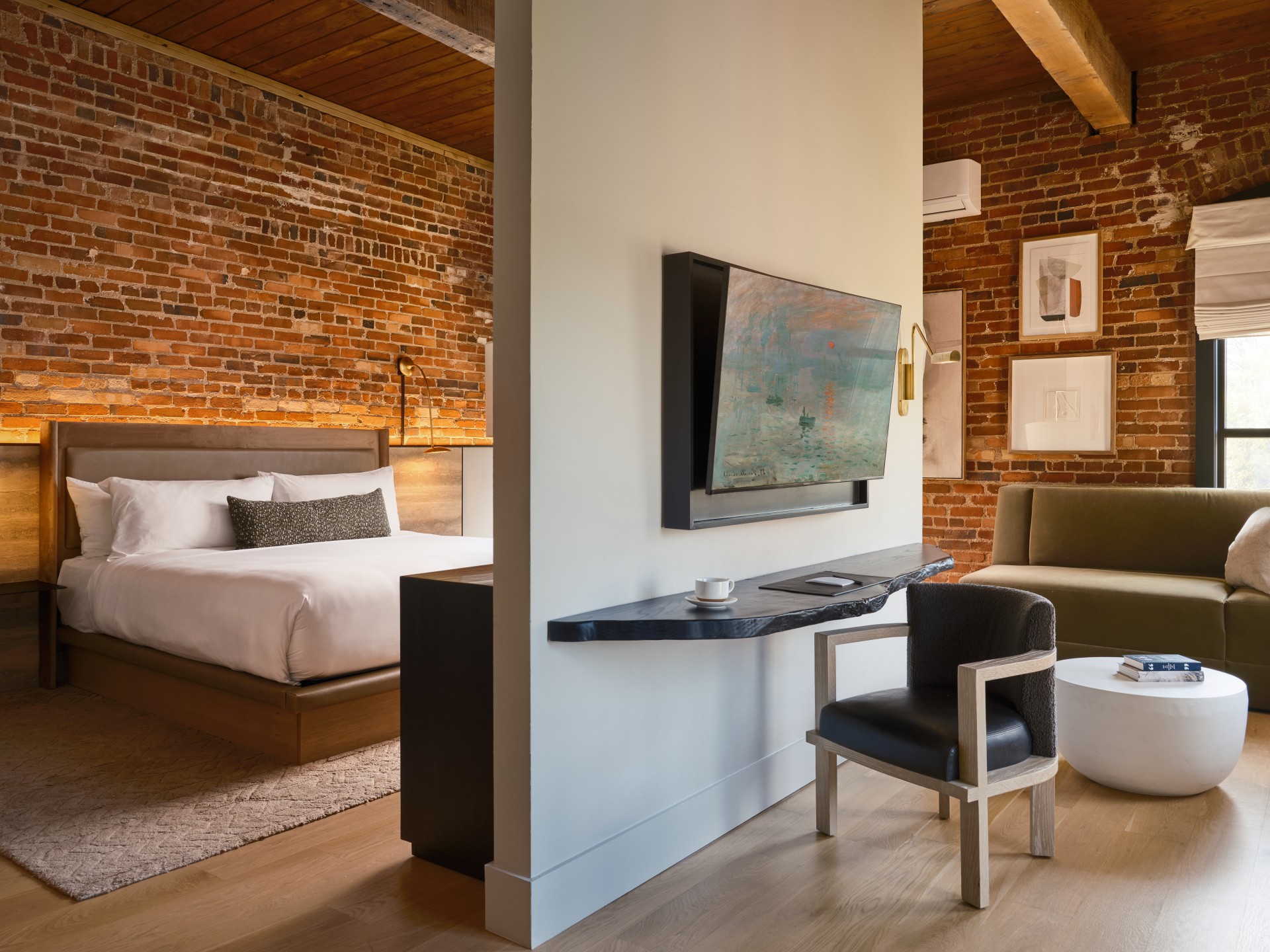 a room with a bed and a tv