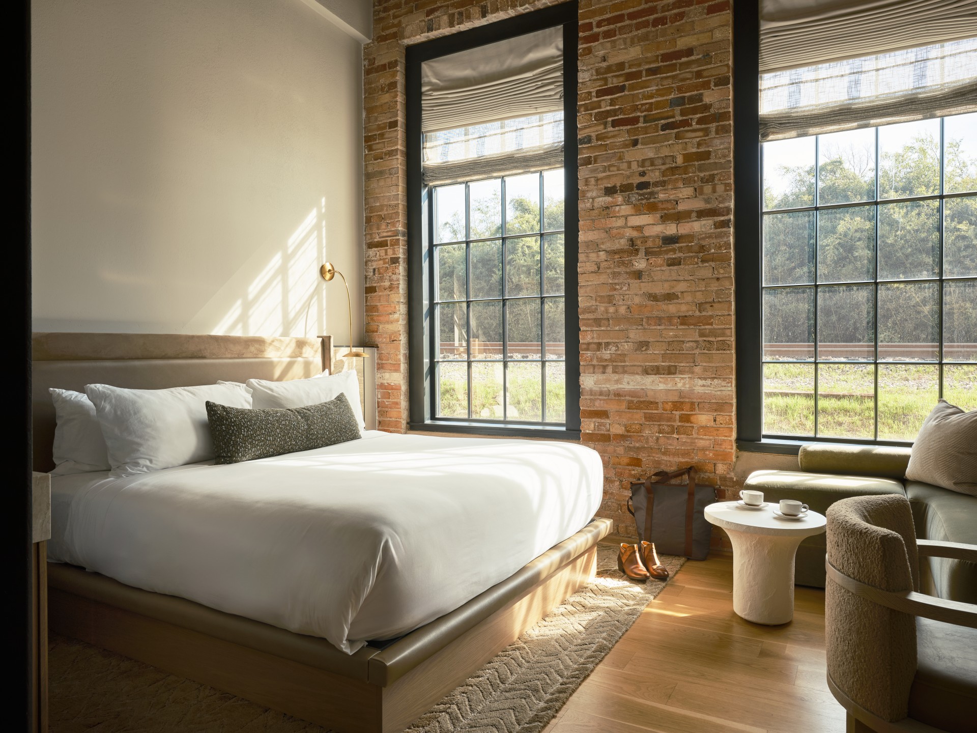 a bedroom with brick walls and a bed