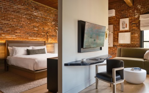 a room with a bed and a tv