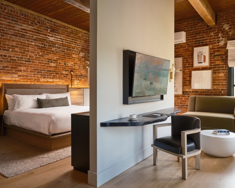 a room with a bed and a tv