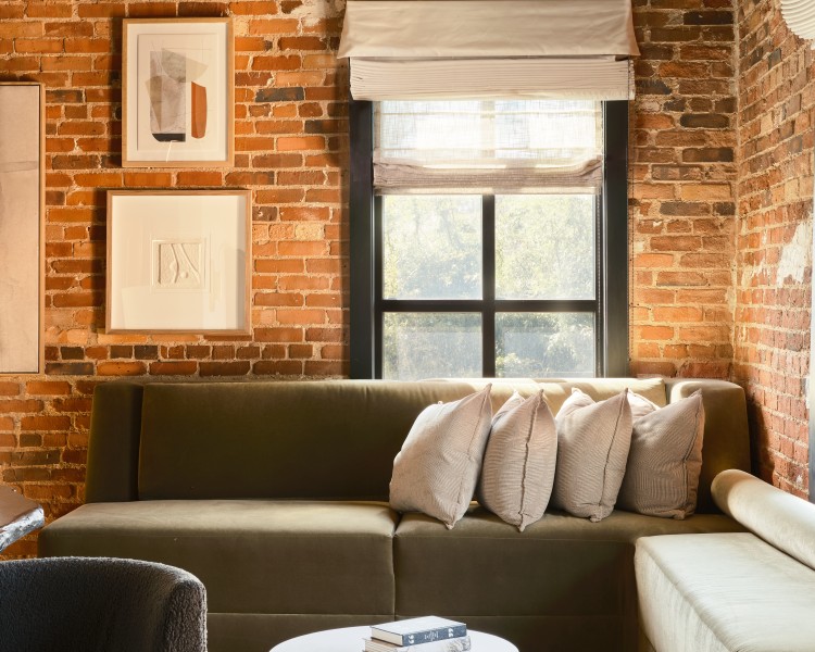 a living room with a couch and a table