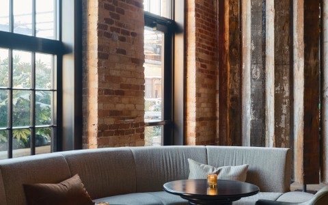 a room with a couch and tables