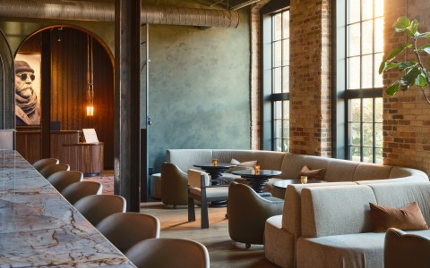 a room with a large table and chairs