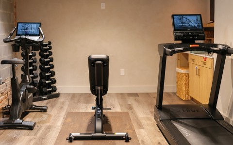 a machine and exercise equipment in a room