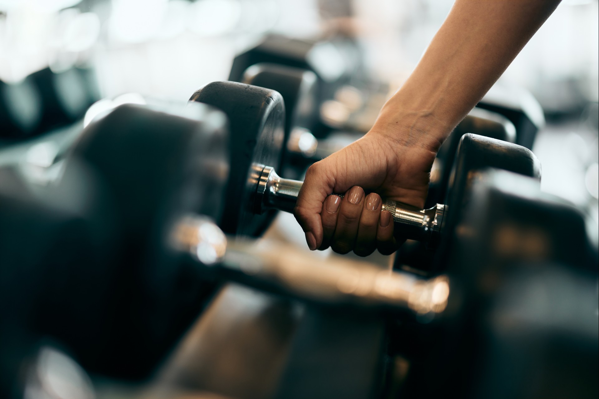 a person holding a dumbbell