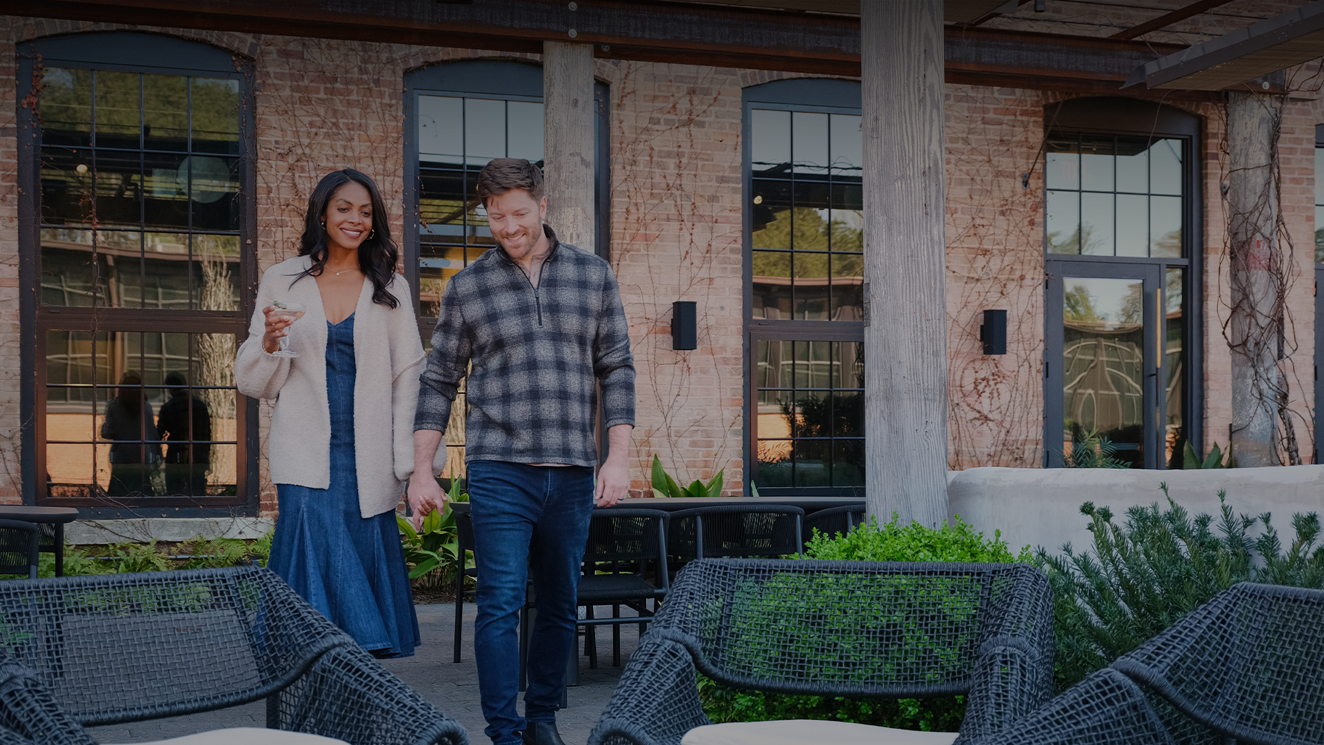 a man and woman walking outside