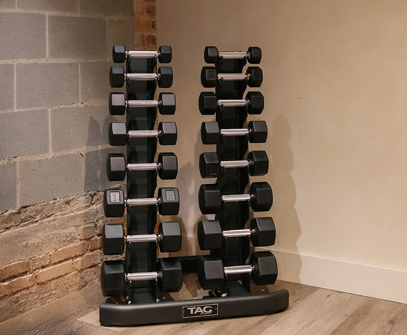 a set of dumbbells on a stand