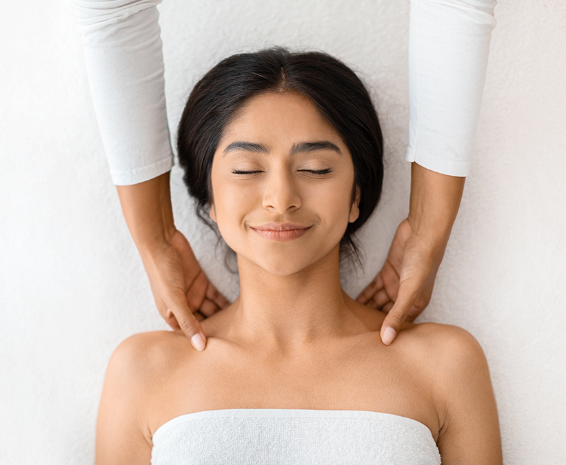 a woman lying on a massage table