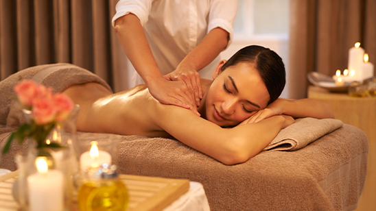a woman lying down on a massage table