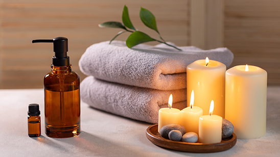 a candles and towels on a table