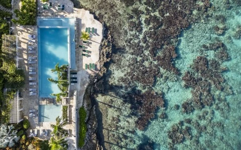 a pool next to a body of water