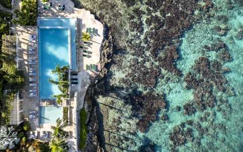 a pool next to a body of water