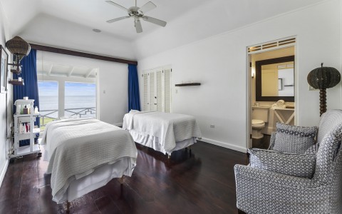 a room with two beds and a couch