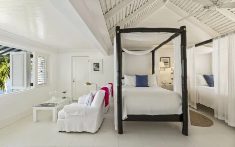 a white room with a bed and a couch