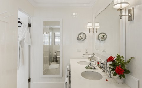 a bathroom with white walls and white countertops