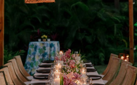 a table set with candles and flowers