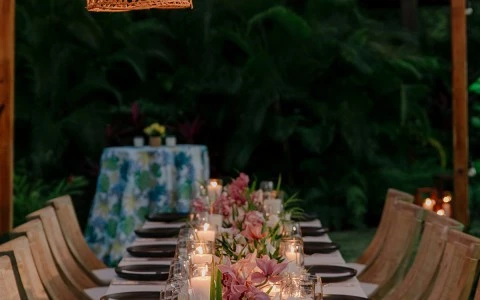 a table set with candles and flowers