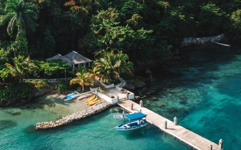 a dock with a boat on it and trees in the background