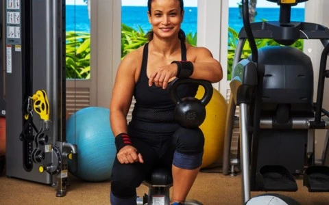 a woman sitting on an exercise machine