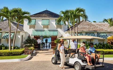 a group of people in a golf cart