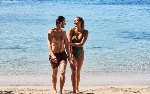 a man and woman on a beach