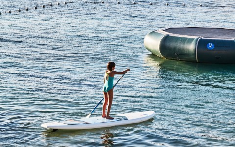 a girl on a paddle board
