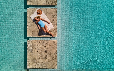 a woman lying on a pool
