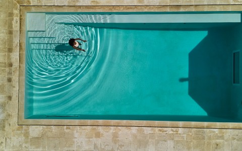 a person swimming in a pool