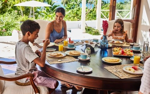 a group of people eating at a table