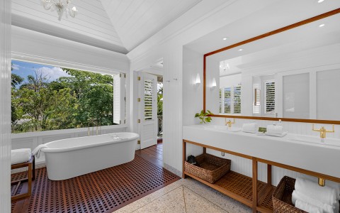 a bathroom with a tub and sink