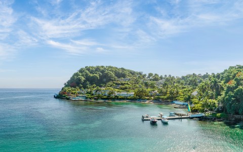 a small island with boats in the water