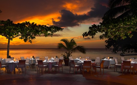 a group of tables set up on a beach