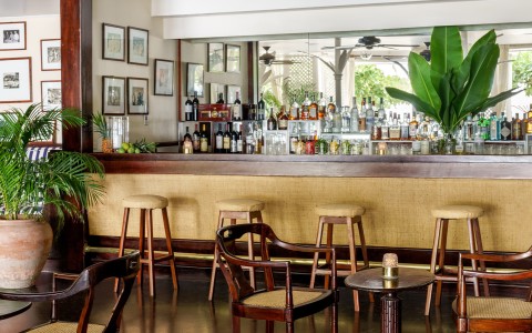 a bar with chairs and a table