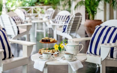 a table with tea set and teapot and cups